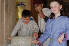 Grinding wheat on a rotary quern